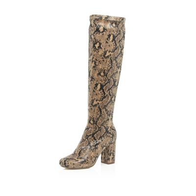 Beige snake print heeled knee high boots